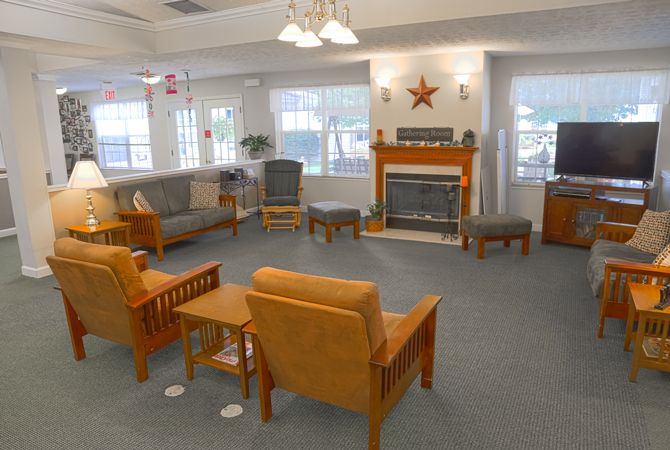 A cozy living room featuring comfortable seating and a fireplace.