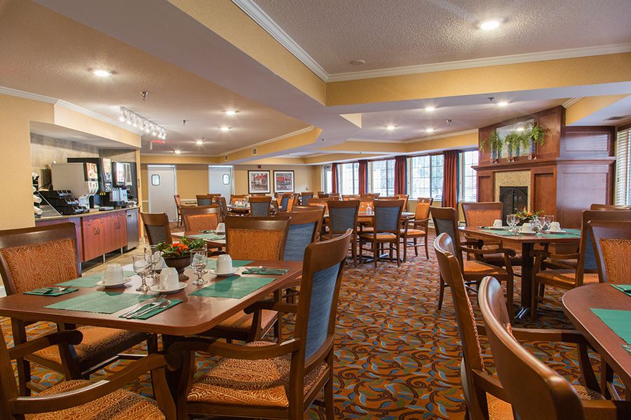A cozy restaurant dining area with neatly arranged tables and chairs, ready for guests.