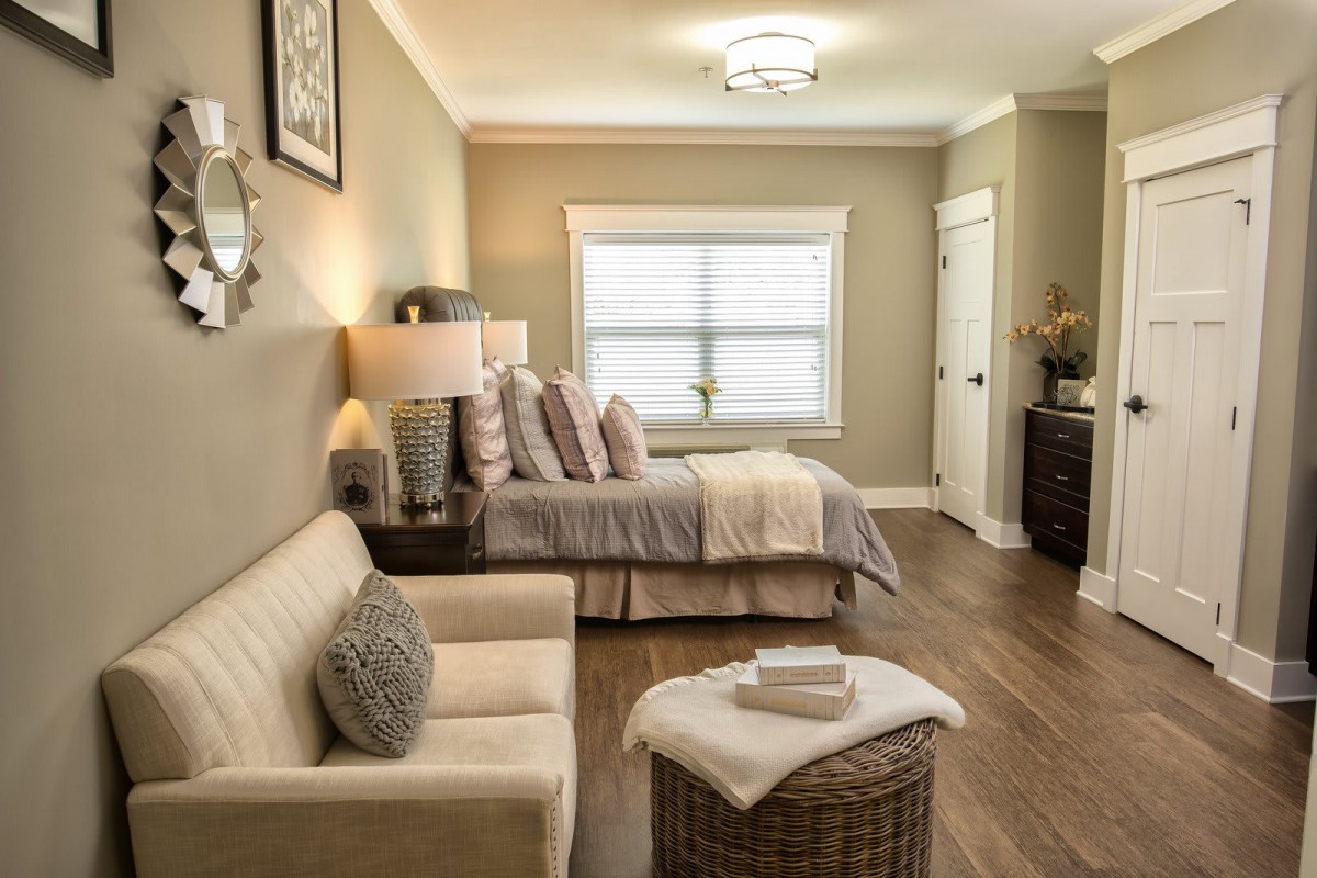 A cozy bedroom with neutral tones and elegant decor.