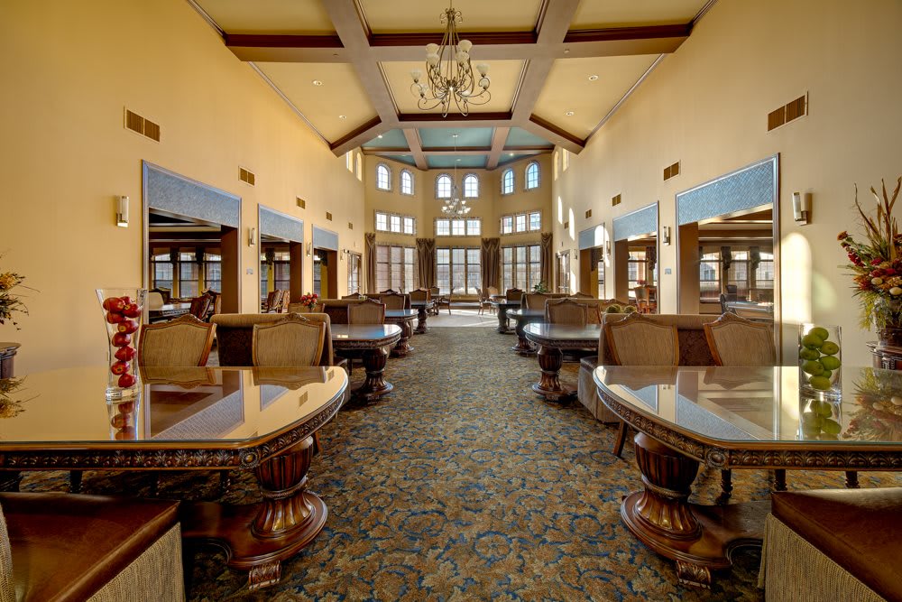 A luxurious lobby with elegant seating and a grand chandelier.