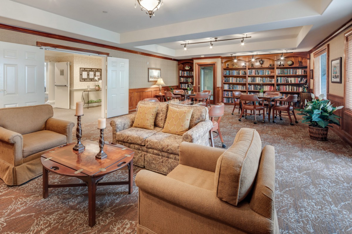 A cozy library with comfortable seating and bookshelves.