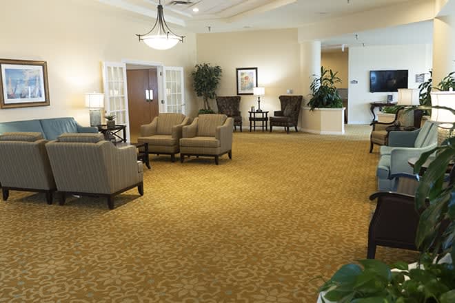 A spacious lobby with comfortable seating and elegant decor.