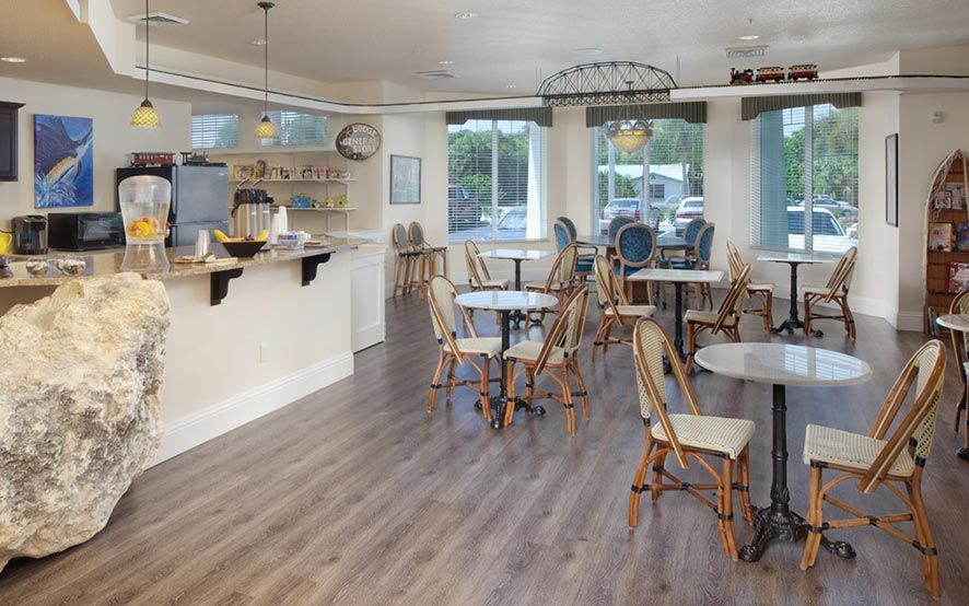 A cozy cafe interior with wooden flooring and modern decor.