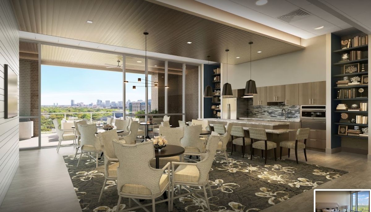 A modern dining area with elegant furnishings and a view through large windows.