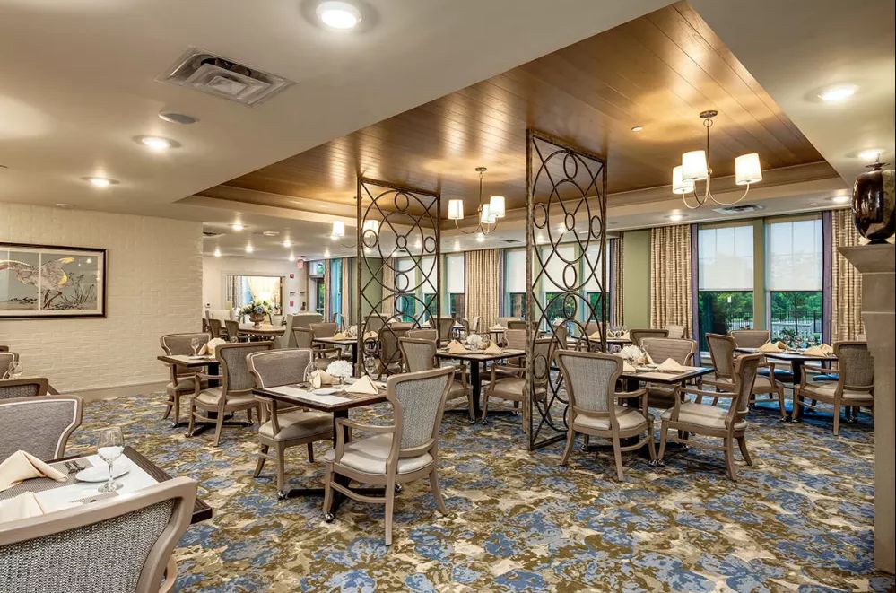 An elegant dining area with modern decor and ample seating.