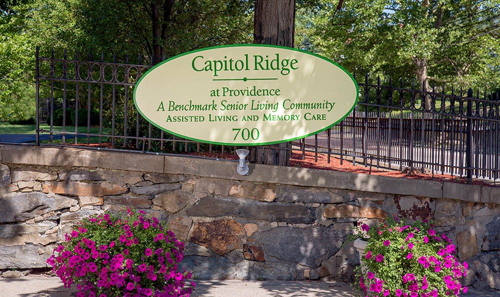 Sign for Capitol Ridge at Providence, a Benchmark Senior Living community offering assisted living and memory care.