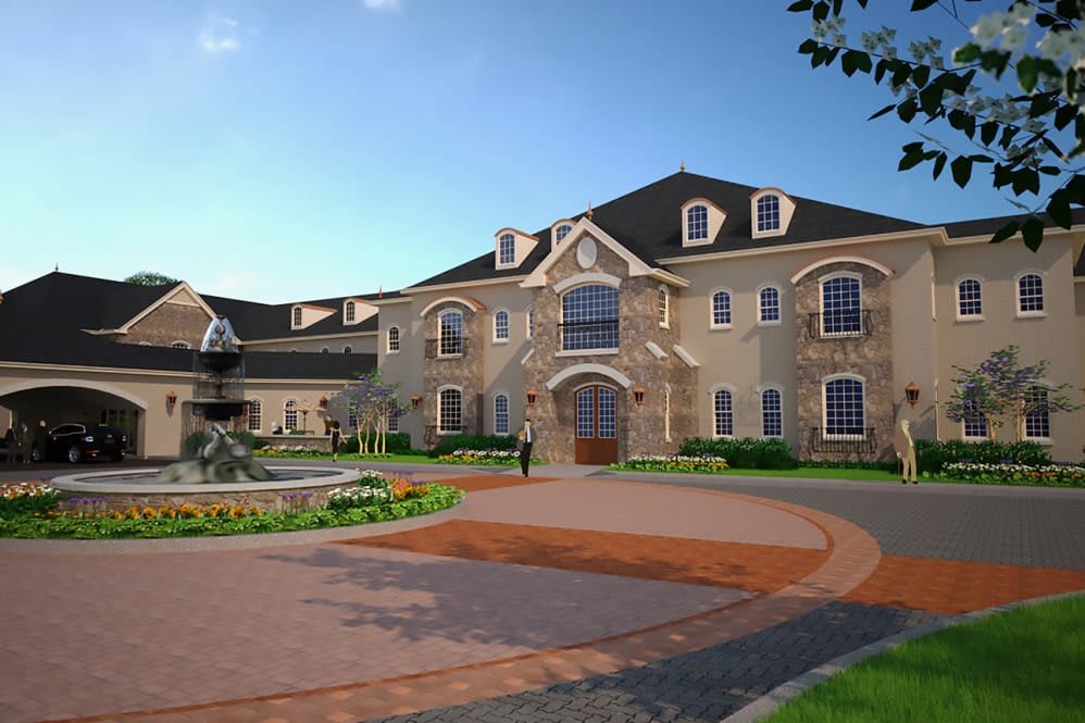 A grand mansion with a circular driveway and well-maintained landscaping.