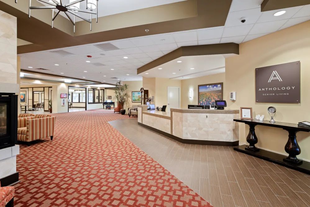 A welcoming hotel lobby with a reception desk and comfortable decor.