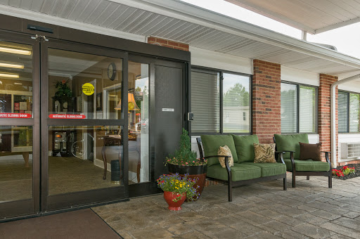 Welcoming entrance of a hotel featuring a cozy seating area.