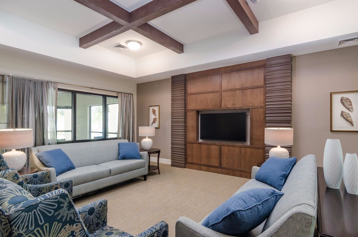 Modern living room with comfortable seating and wooden accents.