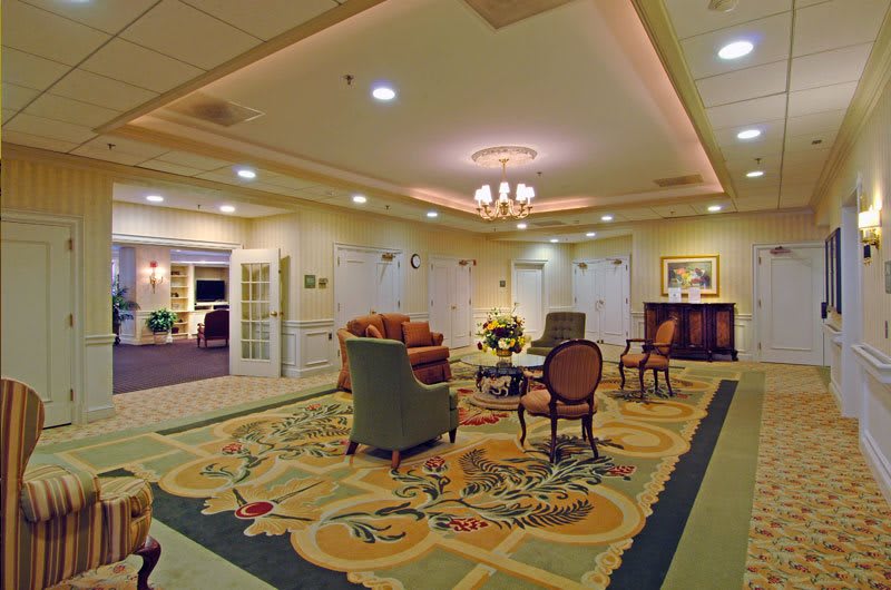 A well-decorated lobby area with comfortable seating and elegant lighting.