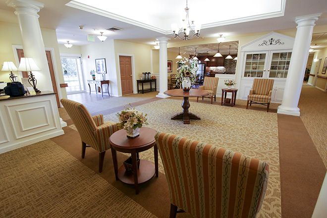A spacious lobby area with comfortable seating and elegant decor.