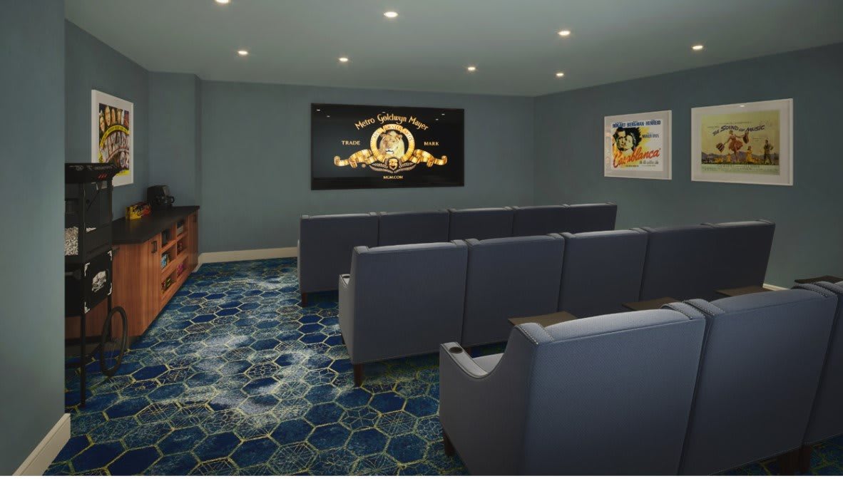 A cozy home theater room with comfortable seating and a large screen, perfect for watching movies.