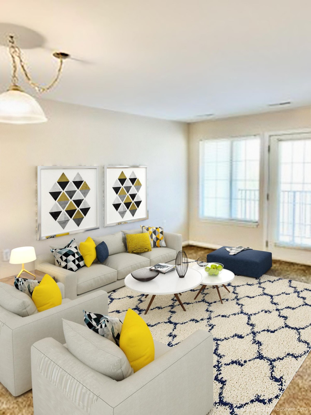 A modern living room with a gray sofa, yellow accent pillows, and geometric artwork.