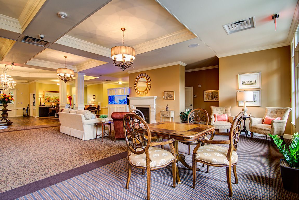 A cozy living room with elegant furniture and warm lighting.