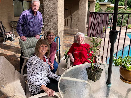 A cheerful gathering of friends enjoying a sunny day outdoors.