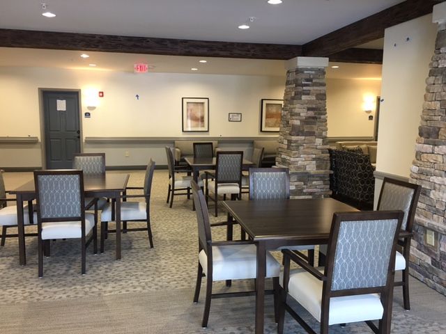 Indoor dining area with neatly arranged tables and chairs.