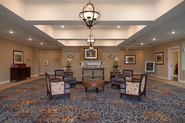 A stylish lobby with comfortable seating and elegant chandeliers.