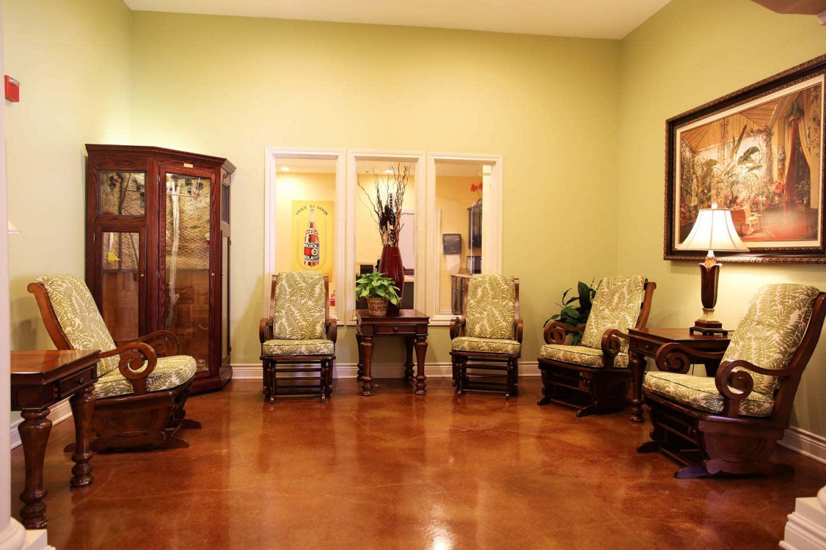A cozy living room with elegant wooden furniture and warm lighting.