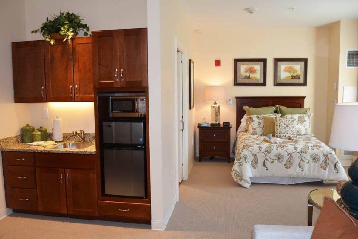 A cozy bedroom with modern wooden furniture and warm decor.