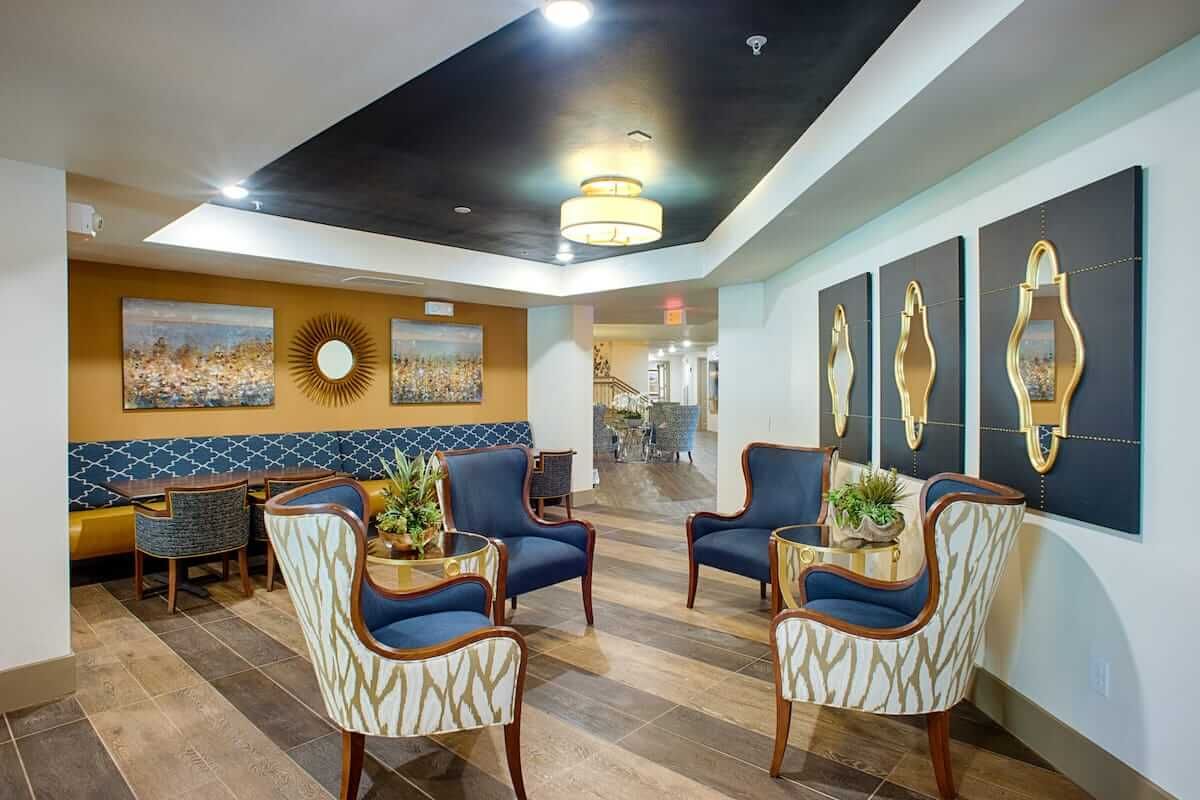 A modern living room with stylish furniture and artwork.