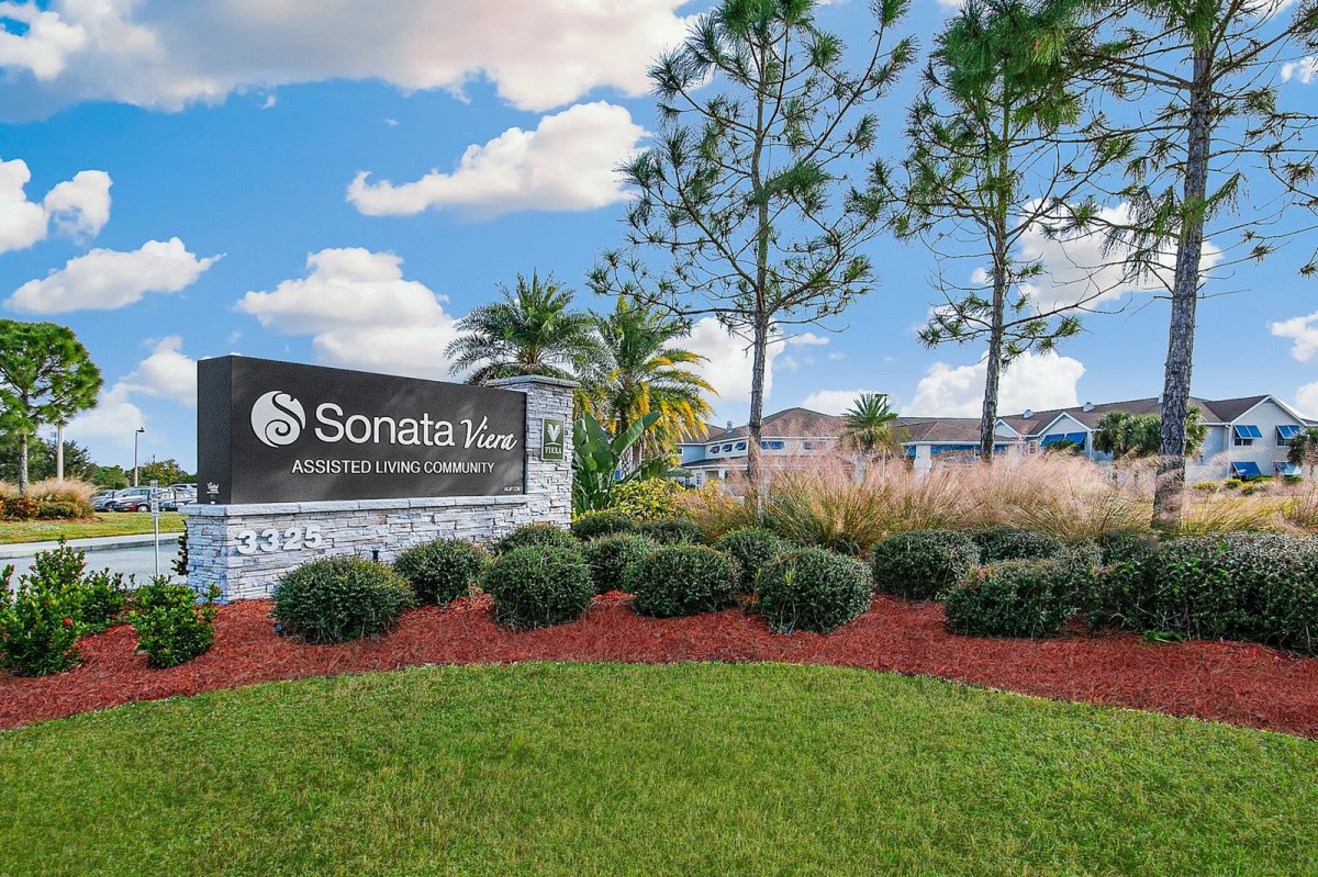 Entrance sign for Sonata West surrounded by well-maintained landscaping and trees.