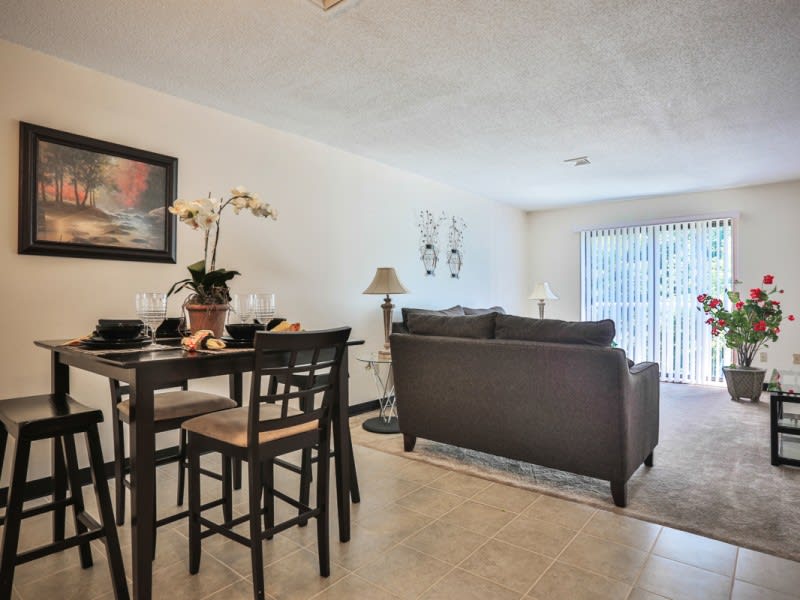 A cozy living and dining area with modern furniture and elegant decor.