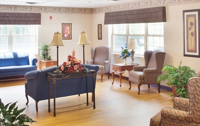 A cozy living room with comfortable seating and decorative elements.