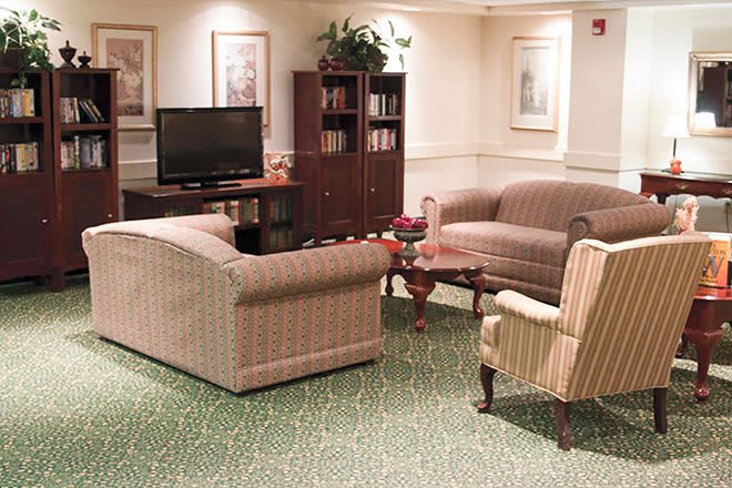 A cozy living room with comfortable seating and a television.