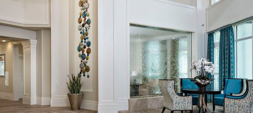 A modern living room with colorful wall art and elegant decor.