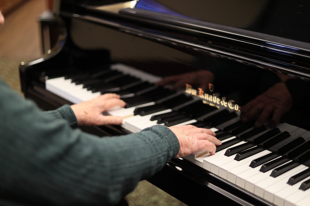 A close-up of a person playing the piano.