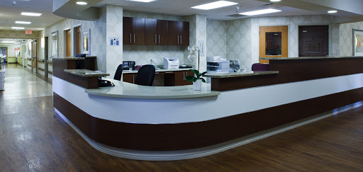 A modern reception area in a medical office, featuring sleek furniture and a welcoming atmosphere.