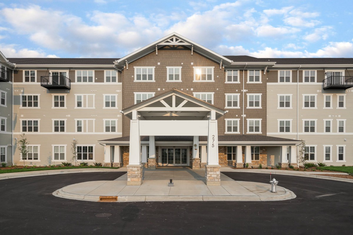 Front view of a modern residential building with a welcoming entrance.