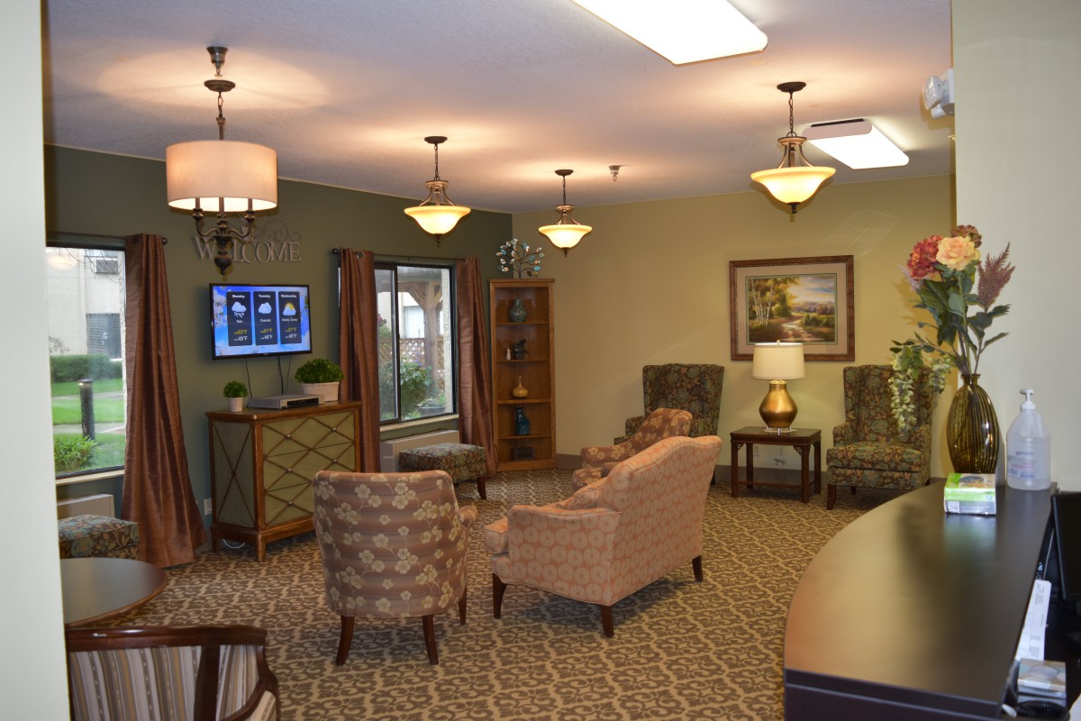 A cozy living room with comfortable seating and warm lighting.