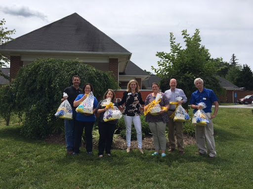 Volunteers gathering for a food distribution event, showcasing community support and teamwork.