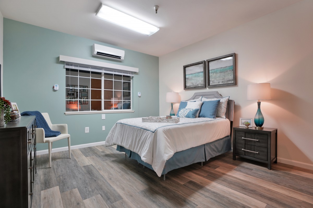 A modern and minimalist bedroom with a comfortable bed and stylish decor.