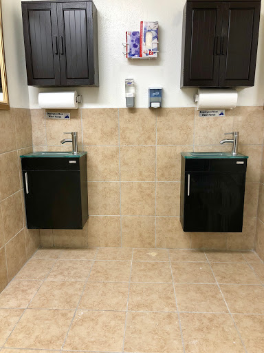 A stylish and modern bathroom setup with dual sinks and cabinets.