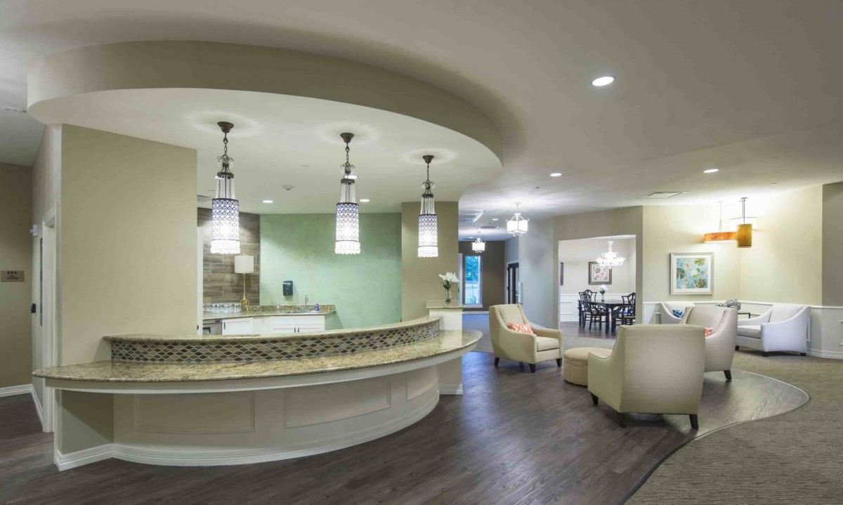 A modern reception area with elegant lighting and comfortable seating.