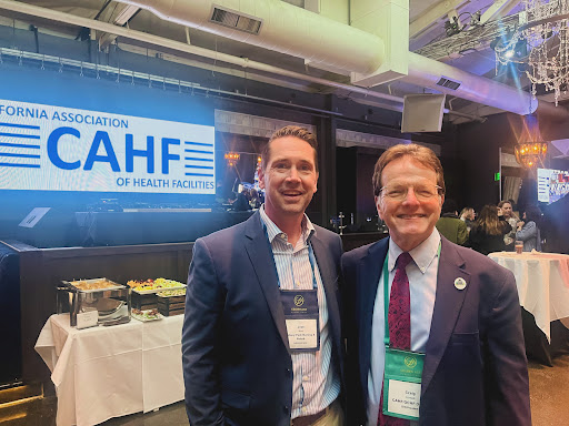 Two professionals posing for a photo at the CAHF event.