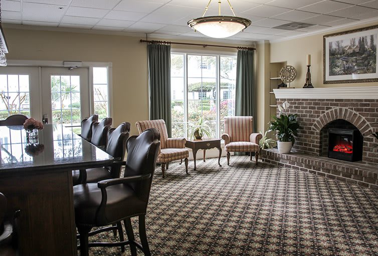 A cozy living room with comfortable seating and a fireplace.