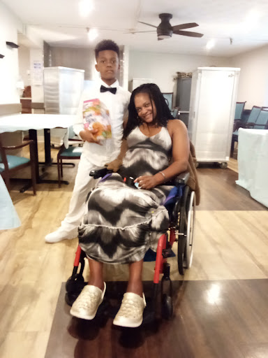 A beautiful moment shared between a mother and her son at a celebration.