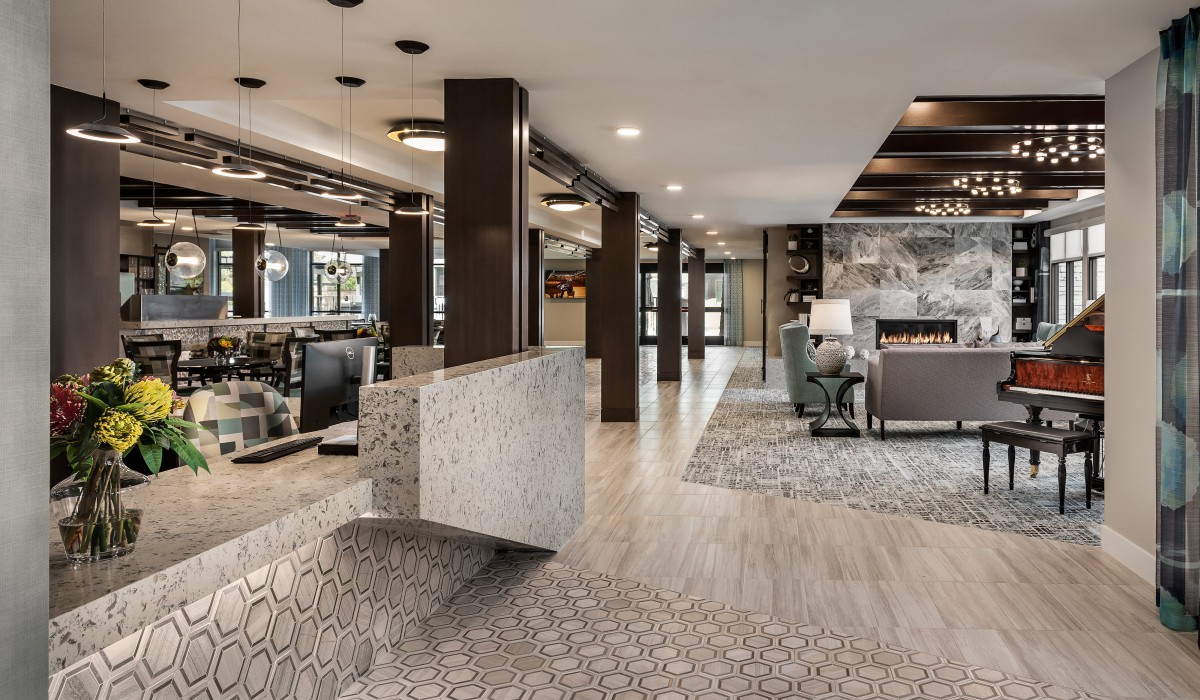 A modern hotel lobby with stylish decor and comfortable seating.