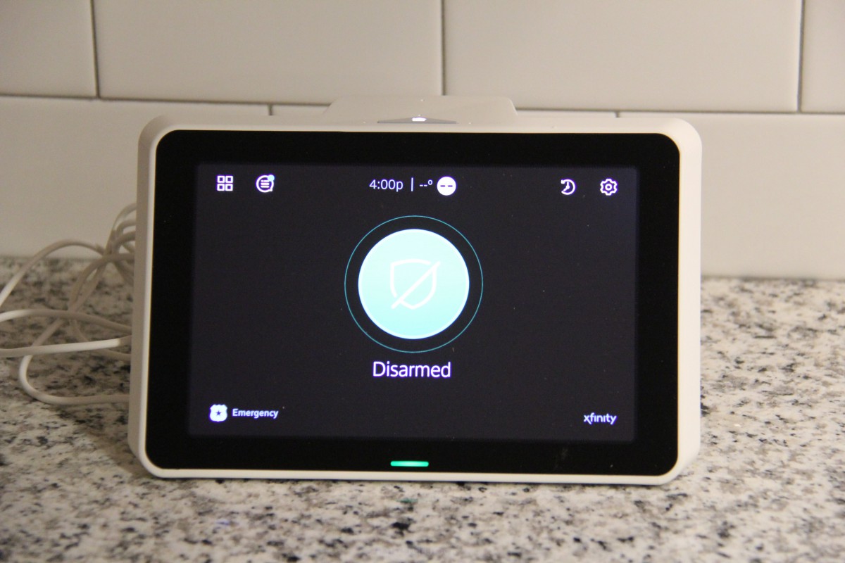A home security system with a disarmed status displayed on the screen.