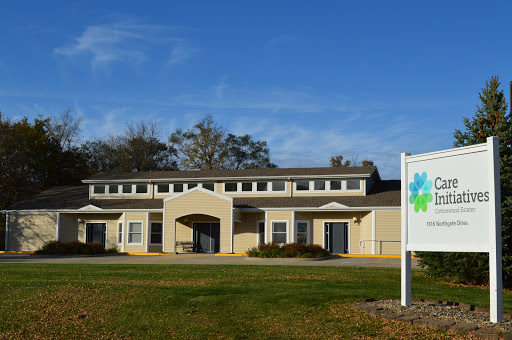 A well-maintained building showcasing modern architecture under a clear blue sky.