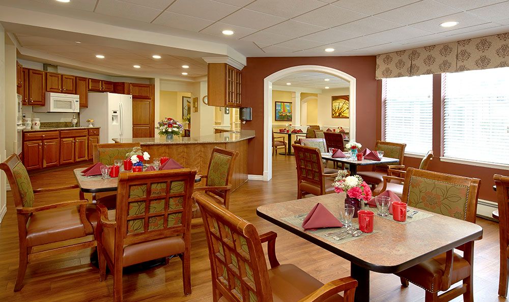 A well-decorated dining area with neatly arranged tables and chairs.