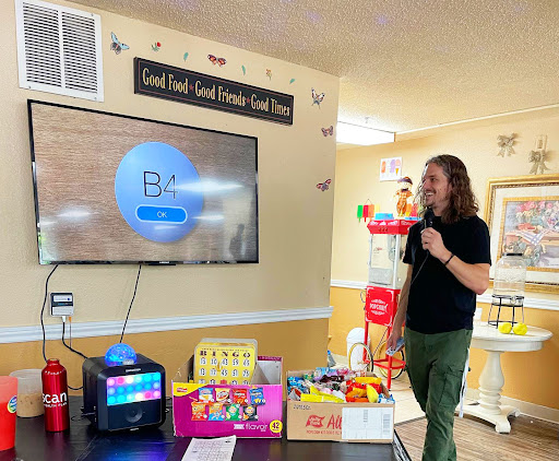 A lively bingo night in a community center, complete with games and colorful toys.
