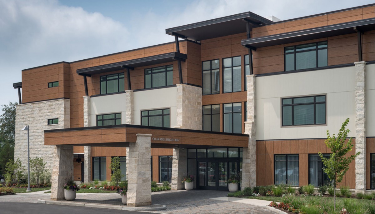 A modern commercial building with a prominent entrance and stylish design.