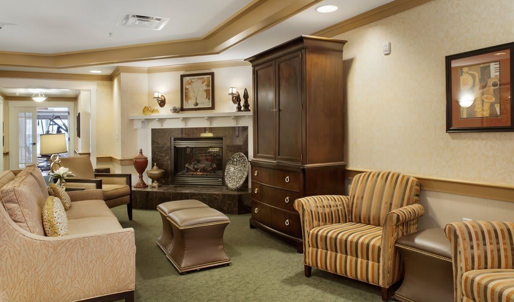 Cozy living room with elegant furniture and a fireplace.