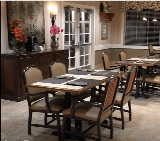 A cozy restaurant dining area with neatly arranged tables and chairs.