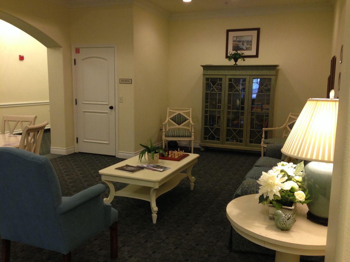 A cozy living room interior with comfortable seating and elegant decor.